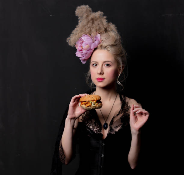 istock Beautiful blonde countess with a burger 1202826372