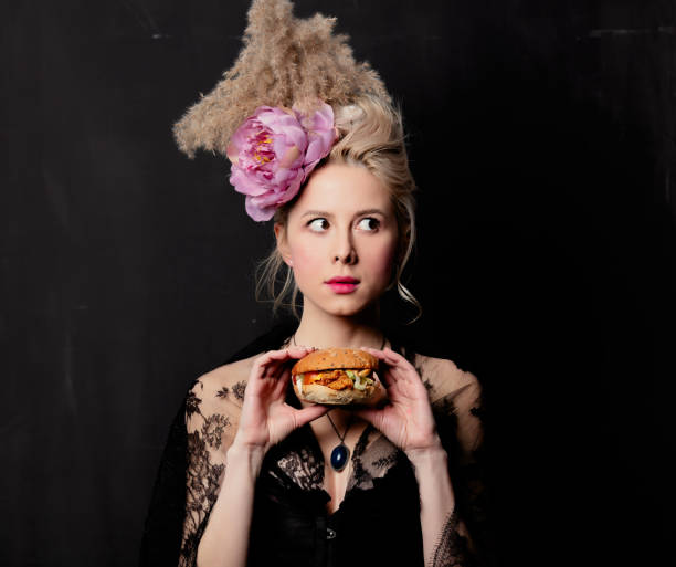istock Beautiful blonde countess with a burger 1202826393
