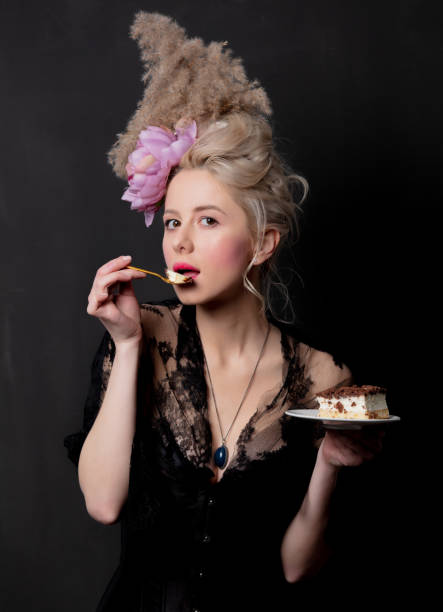 beautiful blonde countess with a cake - baroness imagens e fotografias de stock