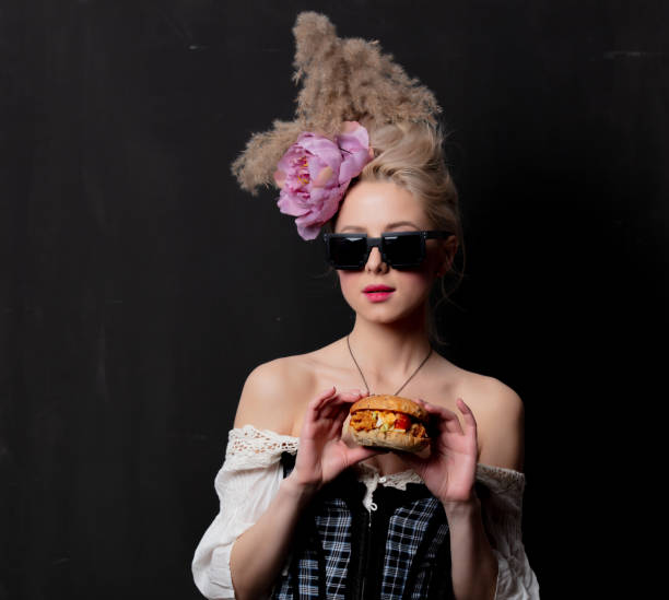 istock Beautiful blonde countess with a burger 1202826827