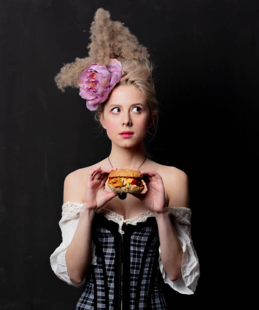 istock Beautiful blonde countess with a burger 1202826832