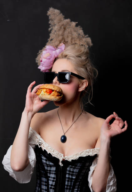istock Beautiful blonde countess with a burger 1202826845