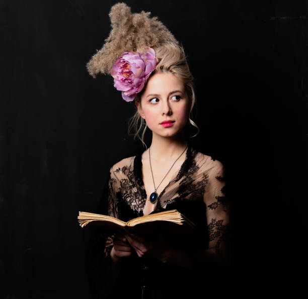 istock Beautiful blonde countess with a book 1202826976