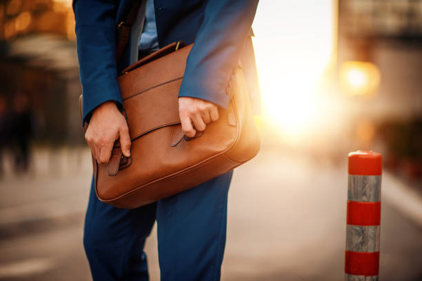 istock Businessman holding his briefcase,close up 1202831049