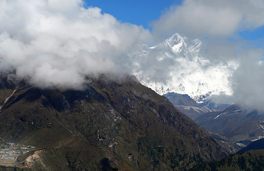 Lhotse  8516m mountain - is 4th higest peak in the world covered with clouds. Hotel Everest View point. Everest Base Camp trekking route near Namche Bazaar, Nepal.