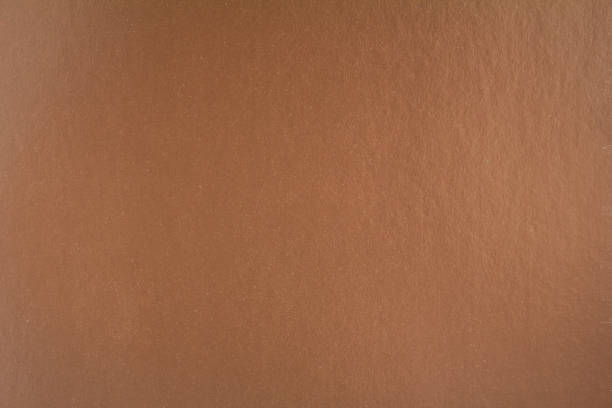 istock Brown sheet of cardboard paper with gloss surface texture background. 1202838022