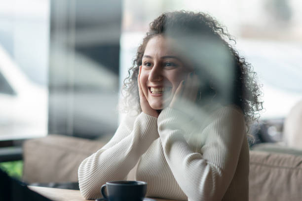 istock Young woman in Coffee Shop 1202838042