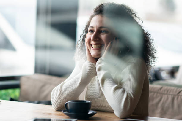 istock Young woman in Coffee Shop 1202838079