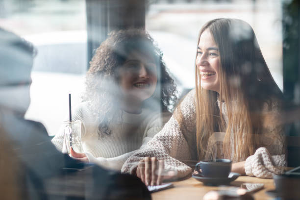 istock Friends in Coffee Shop 1202840393