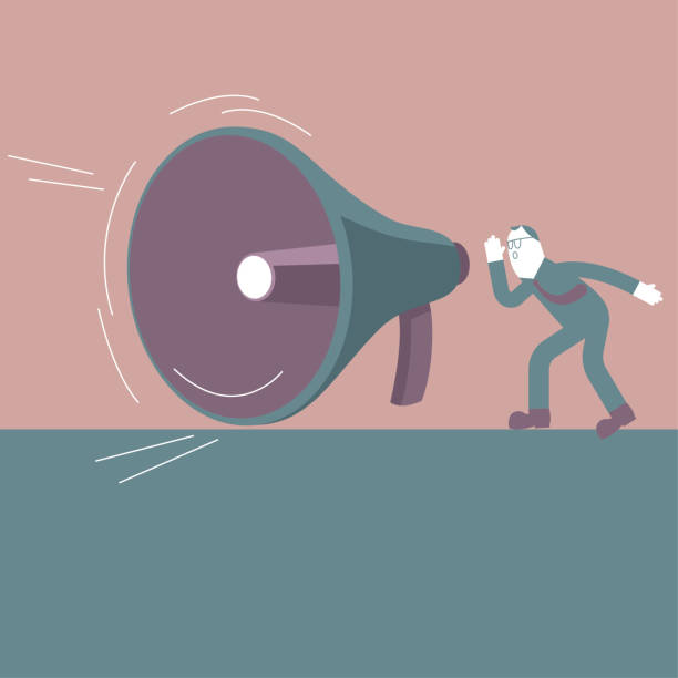 istock A businessman shouted beside a huge megaphone. Marketing concept design. 1202842848
