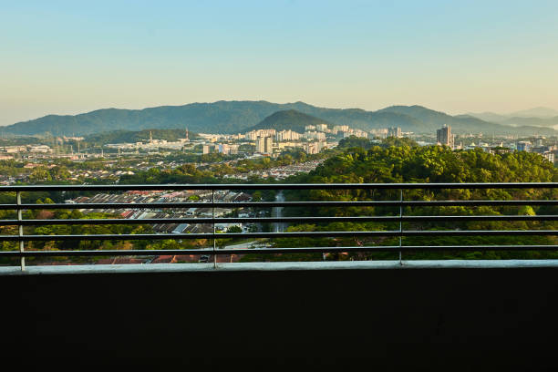 istock Balcony view with buildings and greenery 1202843906
