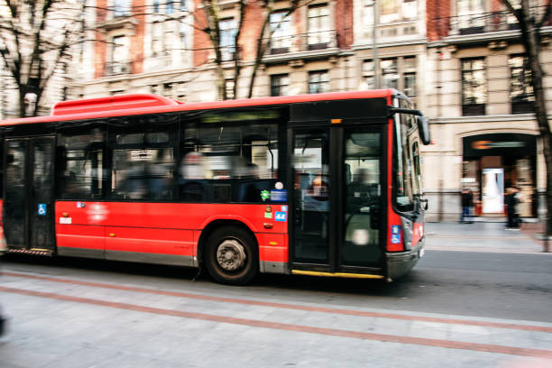 istock Red city bus in motion 1202845702