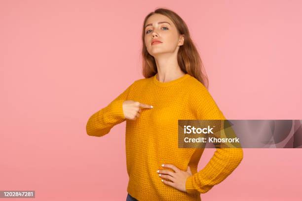 This Is Me Portrait Of Attractive Haughty Ginger Girl In Sweater Pointing At Herself And Looking At Camera With Arrogance Stock Photo - Download Image Now