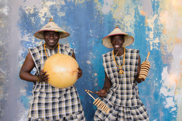 istock Happy african drummers playing music on blue background 1202847321