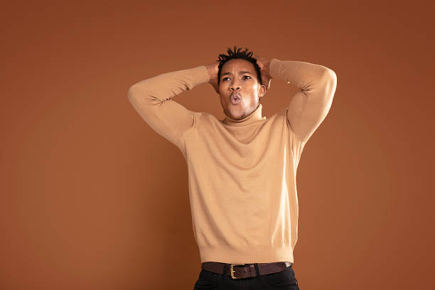 istock Young african man in shock. 1202849514