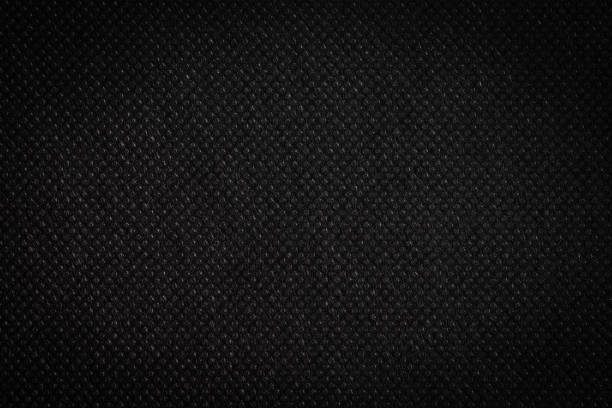 istock Black fabric, luxury dark gray background abstract. Material are used in textile assembly. Detail cloth texture of pattern. Design, elegance with vignette effect, free copy space for text placement. 1202850112