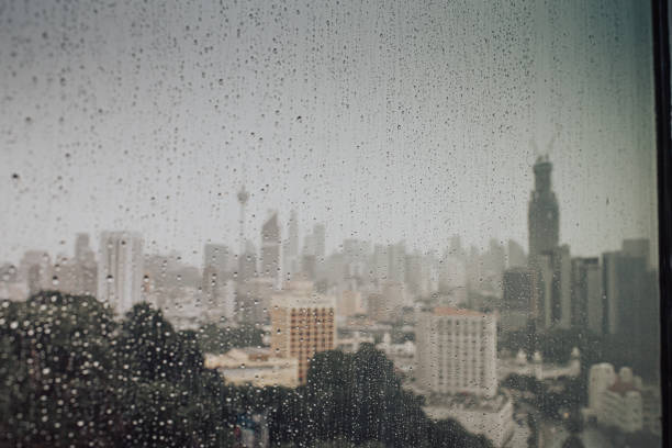istock kuala lumpur cityscape during raining day see thru window 1202850245