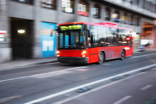 istock Red city bus in motion 1202850342