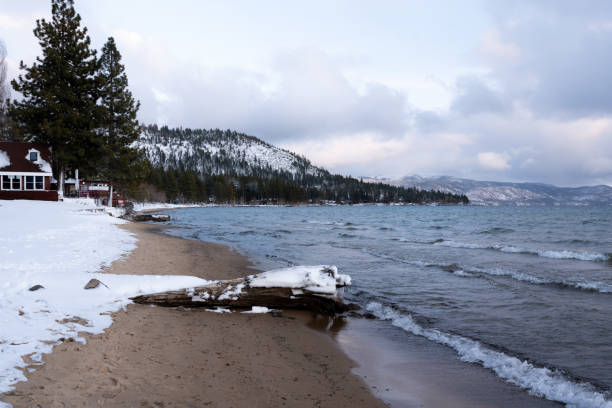 istock Cabin in Snow with Mountains Background 1202850427