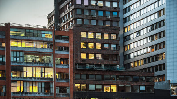 istock Modern office building facades at night 1202852366