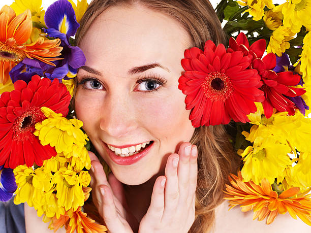 istock Young woman in flowers touching face. 120285278