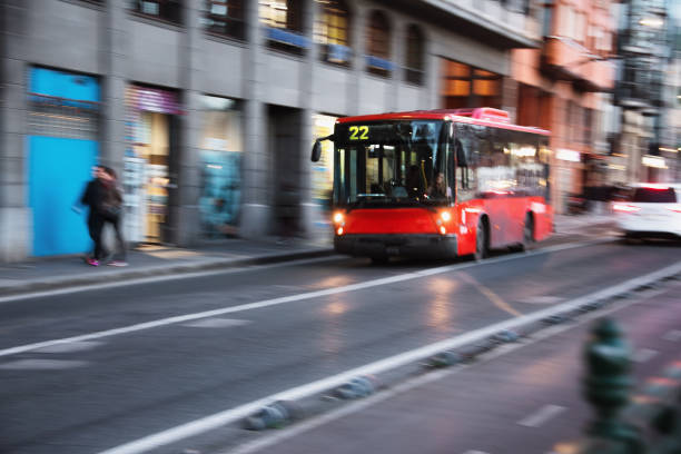 istock Red city bus in motion 1202855328
