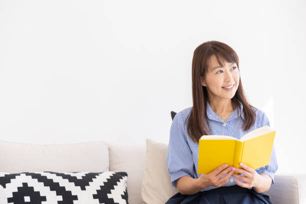 istock asian woman who reads a book 1202856145