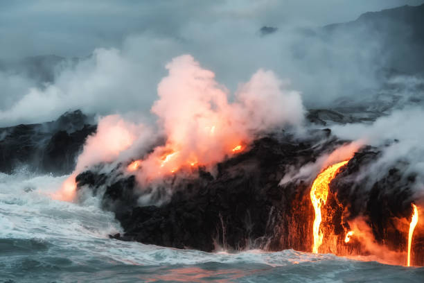 istock Molten lava flowing into the ocean 1202859258