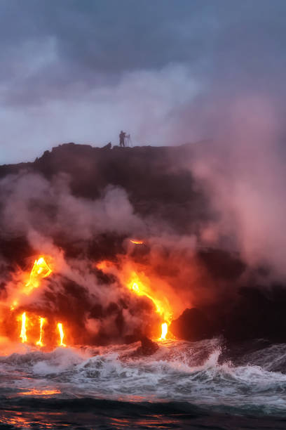 istock Molten lava flowing into the ocean 1202859259