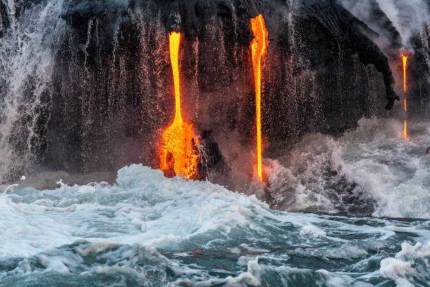 istock Molten lava flowing into the ocean 1202859787