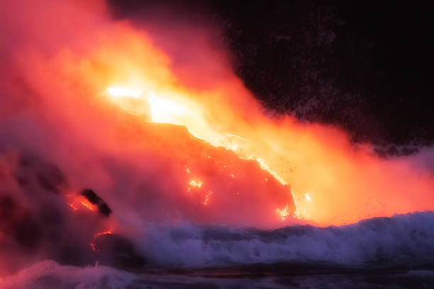 istock Molten lava flowing into the ocean 1202859797