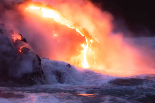 istock Molten lava flowing into the ocean 1202859801