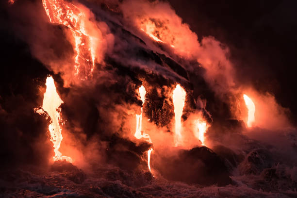 istock Molten lava flowing into the ocean 1202859802