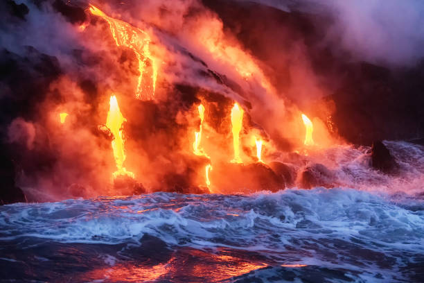 istock Molten lava flowing into the ocean 1202860040