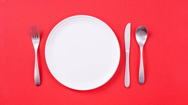 istock Valentine's Day meal design concept - Romantic plate dish set isolated on red background 1202861115