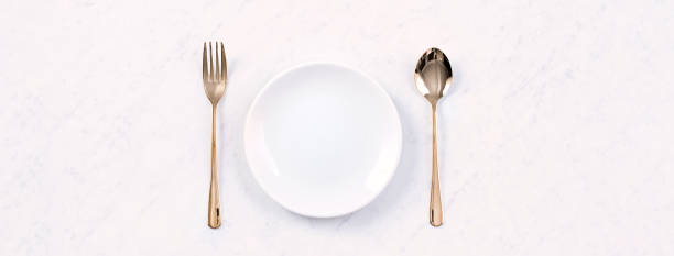 istock Valentine's Day meal design concept - Romantic plate dish set isolated on marble white background 1202861162