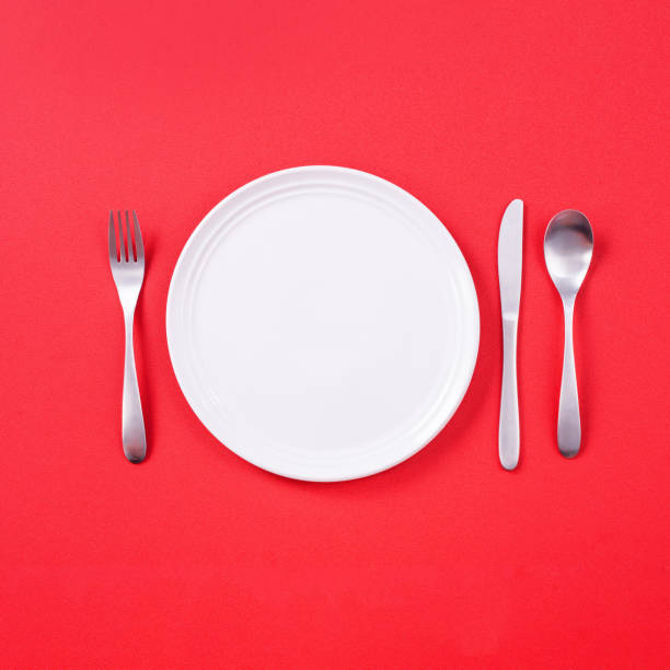 istock Valentine's Day meal design concept - Romantic plate dish set isolated on red background 1202862453