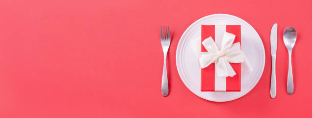 istock Valentine's Day meal design concept - Romantic plate dish set isolated on red background 1202862472