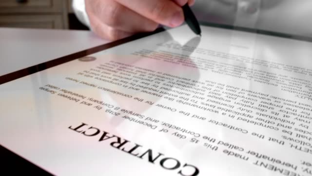 Man sign signature on digital contract at tablet computer in close up view.