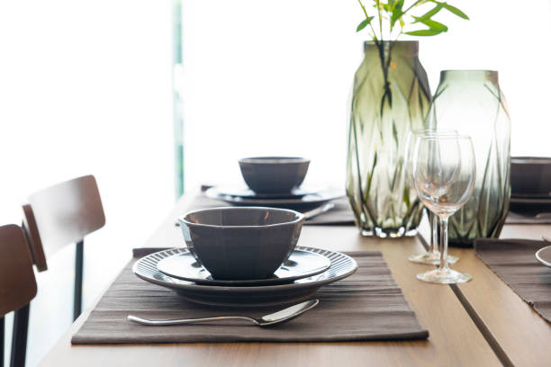 istock Modern dinning room interior with grey plate on wood table 1202872229