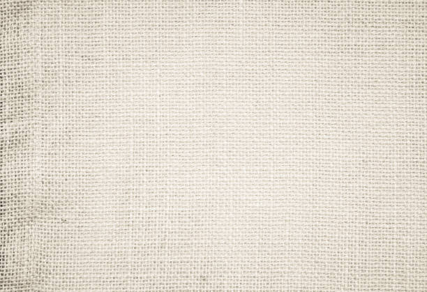 istock Brown Hemp rope texture background. Sackcloth or blanket wale linen wallpaper. Rustic sack canvas fabric texture in natural. Haircloth vintage linen burlap weaving, Old beige carpet background. 1202872446