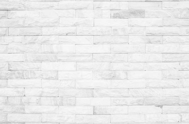 istock Medieval natural stone wall texture background or boundary the rock seamless abstract and decor fragment of design vintage wallpaper pattern chipped ancient from white color for interior copy space. 1202873113