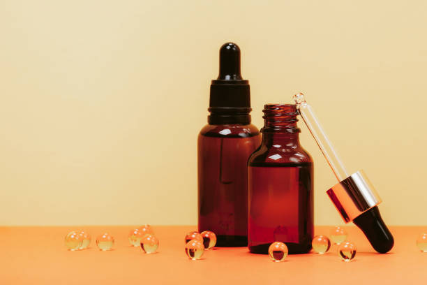 istock Face serum and vitamin capsules 1202875135
