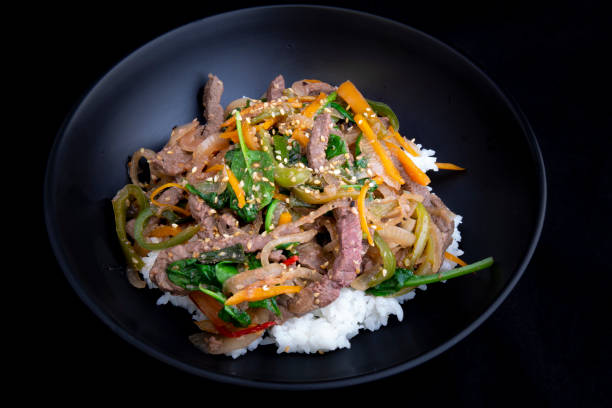 istock stir fry beef and vegetables with rice 1202881762