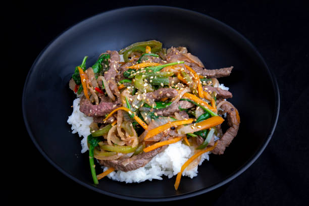 istock stir fry beef and vegetables with rice 1202881778