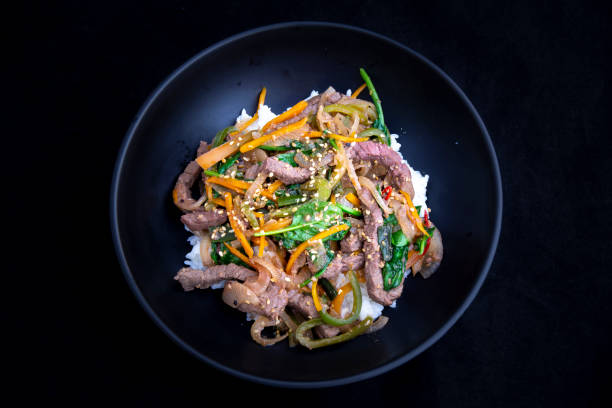 istock stir fry beef and vegetables with rice 1202882439
