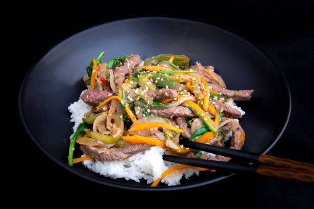 istock stir fry beef and vegetables with rice 1202882708