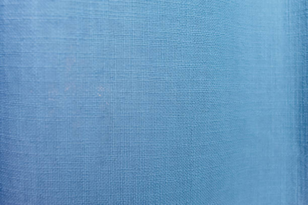 istock bright blue uniform texture of cotton fabric with large threads and knots 1202882951