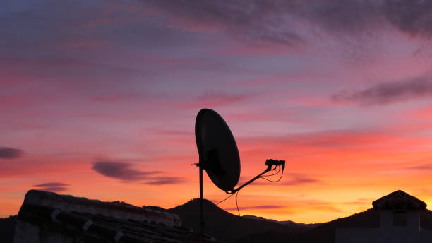 istock Satelite dish silhouette against golden Andalusian dawn 1202887298