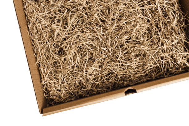 istock Opened cardboard box with decorative shredded paper for gifting and stuffing. 1202891662